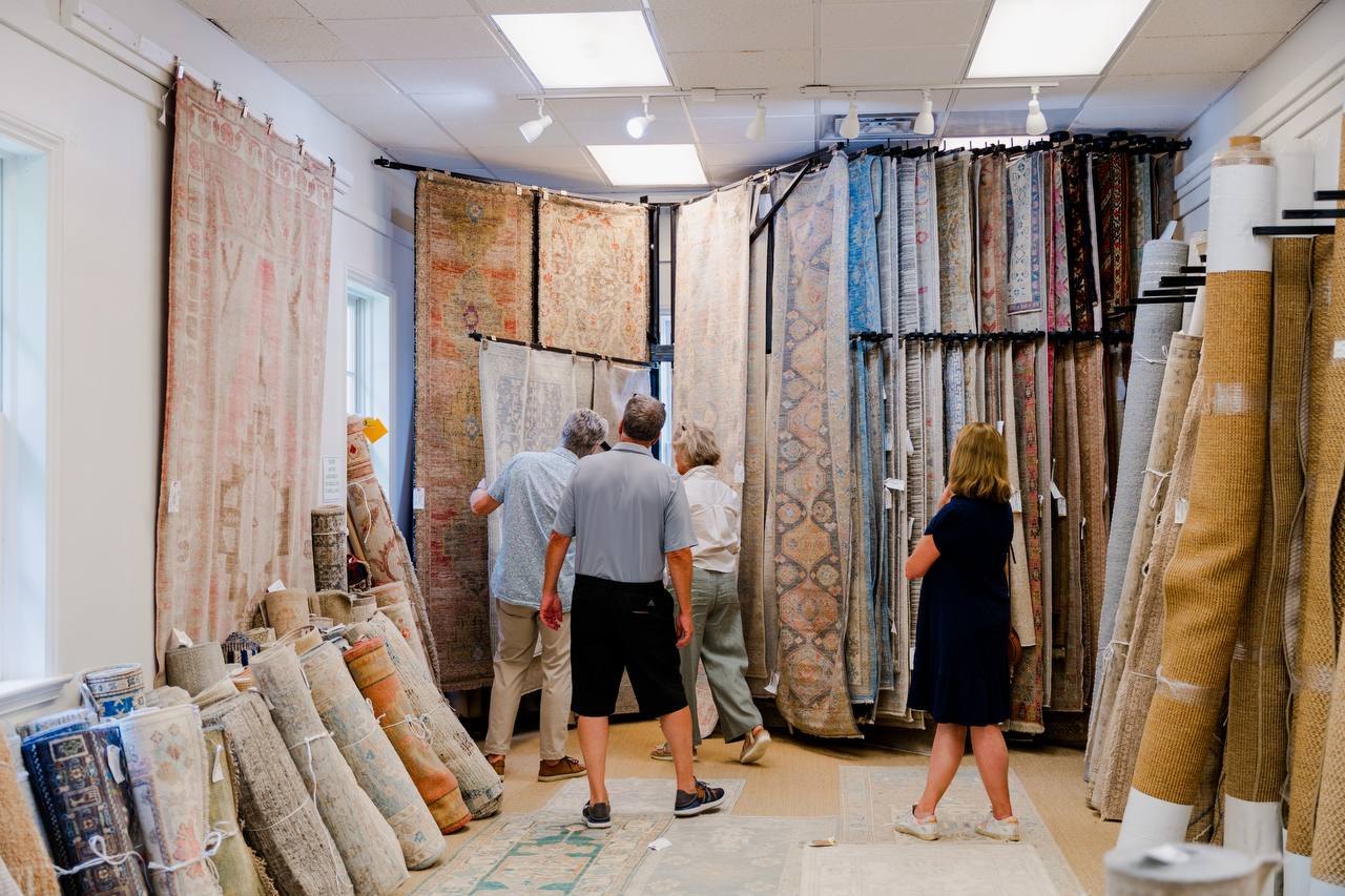 Customers browsing rugs at Dwyer Rugs