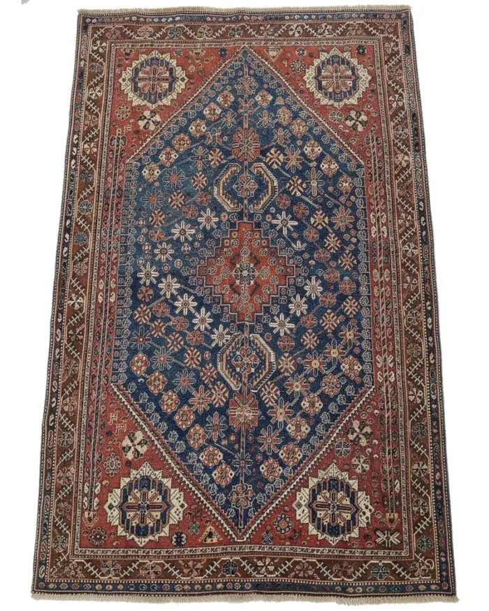 A handmade vintage Persian Shiraz 5'3x8'4.